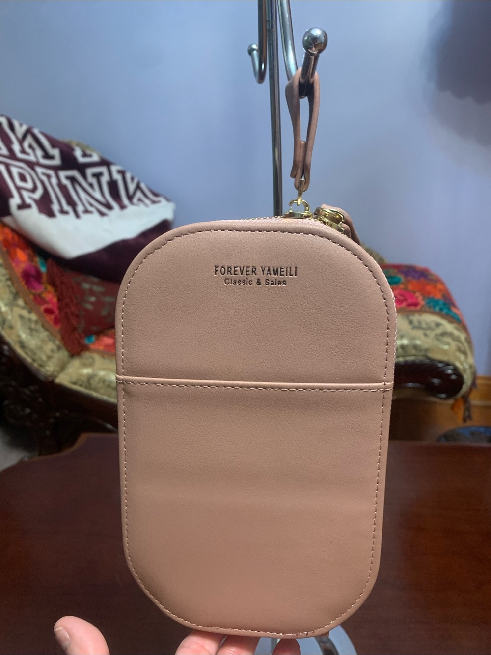 Forever Blush Pink Crossbody Pouch with attachable strap.